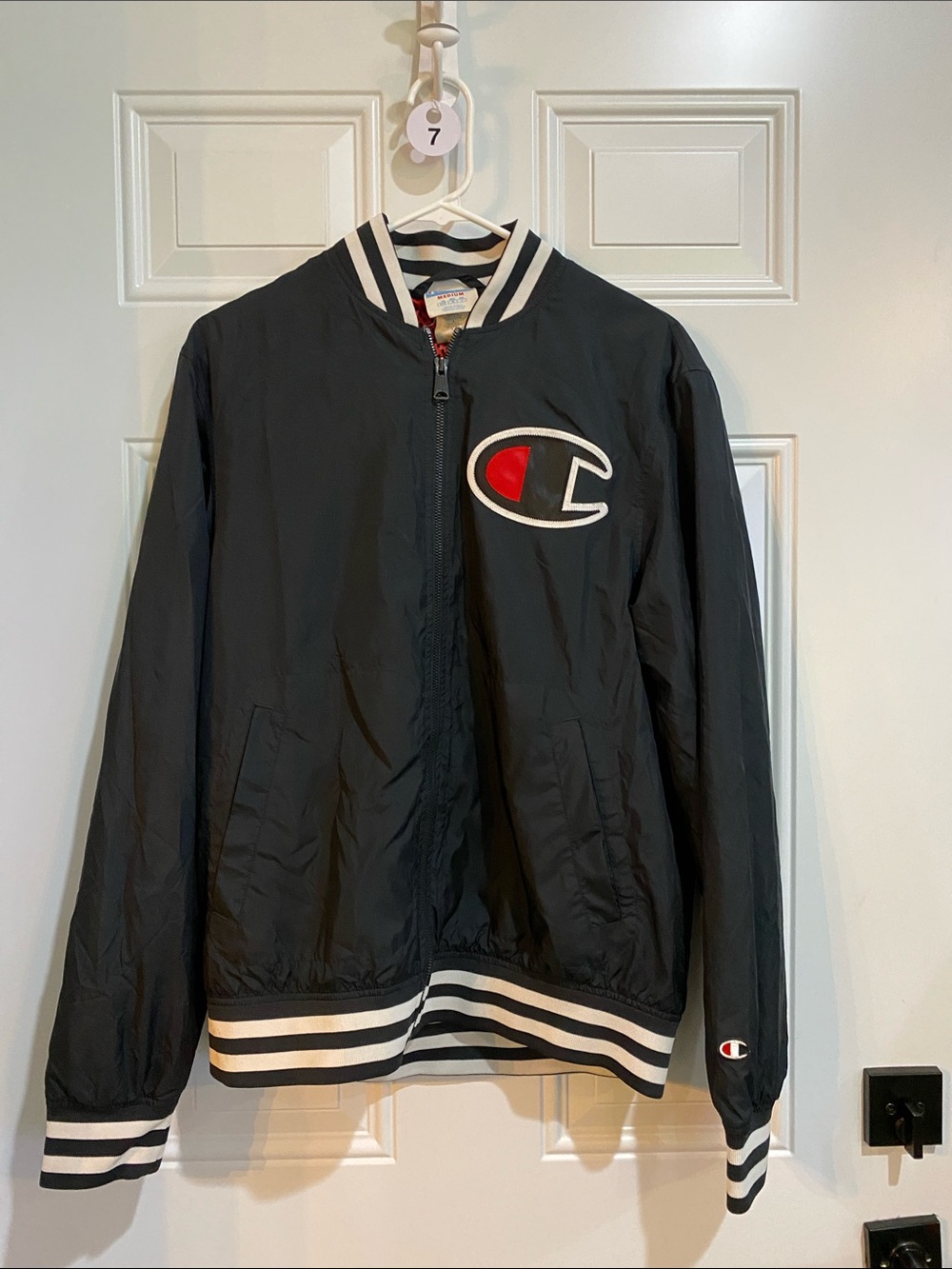 Champion Black Bomber Jacket with Red Logo Patch